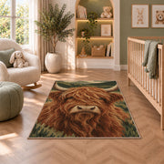 Highland Cow Close-Up rug in a nursery with a crib and armchair
