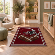 Football Helmet rug in a nursery with a crib and armchair