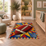 Pop Art Football rug in a nursery with a crib and armchair