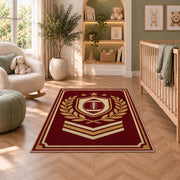Varsity Football Emblem rug in a nursery with a crib and armchair