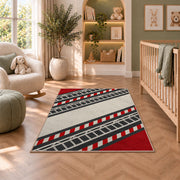 Fire Ladder Stripe rug in a nursery with a crib and armchair