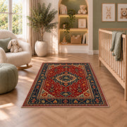 Persian Style Firefighter rug in a nursery with a crib and armchair