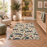 Fishing gear pattern rug in a nursery with a crib and armchair