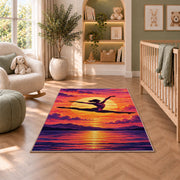 Gymnast Sunset Leap Rug in a nursery with a crib and armchair