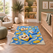 Cute Dreidel Kids Rug in a nursery with a crib and armchair