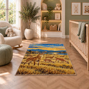 Deer Herd Meadow rug in a nursery with a crib and armchair