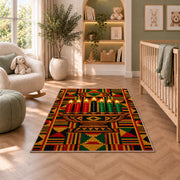 Kente Pattern Kwanzaa Rug in a nursery with a crib and armchair