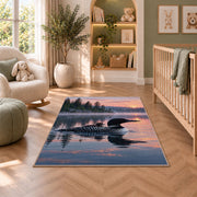 Loon and chick at sunrise rug in a nursery with a crib and armchair