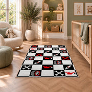 Checkered racing garage rug in a nursery with a crib and armchair