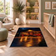 Garage at night with a muscle car rug in a nursery with a crib and armchair