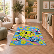 Cute Pickleball Character Rug in a nursery with a crib and armchair