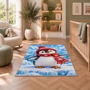Baby Penguin Rug in a nursery with a crib and armchair