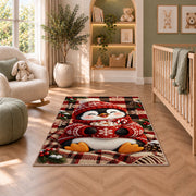 Hot Cocoa Penguin Rug in a nursery with a crib and armchair
