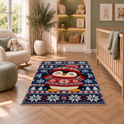 Nordic Sweater Penguin Rug in a nursery with a crib and armchair