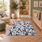 Ski gear pattern rug in a nursery with a crib and armchair
