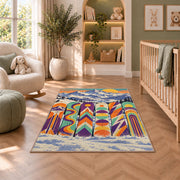 Retro snowboards rug in a nursery with a crib and armchair