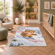 Teddy bear skier rug in a nursery with a crib and armchair