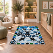 Trail difficulty symbols rug in a nursery with a crib and armchair