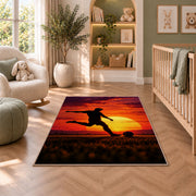 soccer player silhouette at sunset rug in a nursery with a crib and armchair
