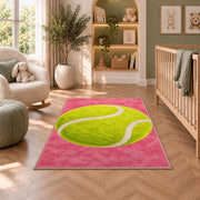 Giant Tennis Ball Rug in a nursery with a crib and armchair