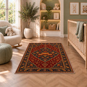 Persian Style Pumpkin Rug in a nursery with a crib and armchair