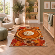 Pumpkin Pie Rug in a nursery with a crib and armchair