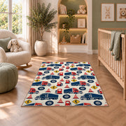 Semi truck pattern rug in a nursery with a crib and armchair