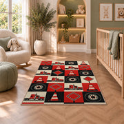 Checkered trucks and road signs rug in a nursery with a crib and armchair