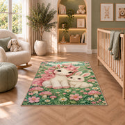 baby unicorn and bunny friend rug in a nursery with a crib and armchair