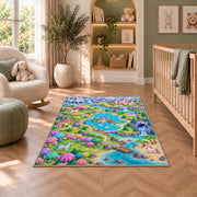 unicorn land map rug in a nursery with a crib and armchair