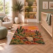 Desert longhorn sunset rug in a nursery with a crib and armchair
