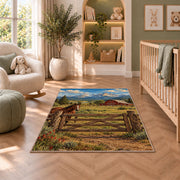Ranch gate and barn rug in a nursery with a crib and armchair
