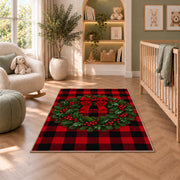 Buffalo Plaid Christmas Wreath rug in a nursery with a crib and armchair