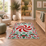 Peppermint Candy Swirl rug in a nursery with a crib and armchair