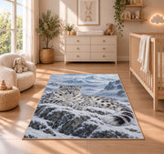 Snow Leopard Mountain Rug in a nursery beside a crib and dresser