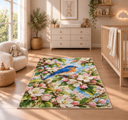 Bluebird on Blossom Branch Rug in a nursery beside a crib and dresser