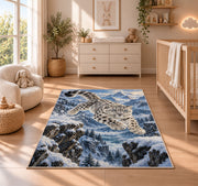 Leaping Snow Leopard Rug in a nursery beside a crib and dresser