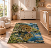 Leopard Drinking at Lake Rug in a nursery beside a crib and dresser