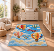 Hot Air Balloon Rug in a nursery beside a crib and dresser