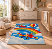 Rainbow Airplane Rug in a nursery beside a crib and dresser