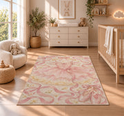 Pink tutu on hanger rug in a nursery beside a crib and dresser