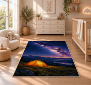Orange Tent Under the Milky Way rug in a nursery beside a crib and dresser