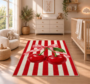 Candy Stripe Cherry Rug in a nursery beside a crib and dresser