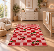 Checkered Cherry Rug in a nursery beside a crib and dresser