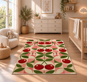 Geometric Cherry Rug in a nursery beside a crib and dresser