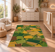 Patchwork Farm Fields Aerial rug in a nursery beside a crib and dresser