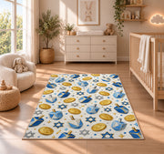 Dreidel and Gelt Pattern Rug in a nursery beside a crib and dresser