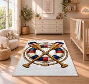 Crossed oars and life ring rug in a nursery beside a crib and dresser