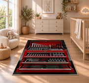 Red toolbox with open drawers rug in a nursery beside a crib and dresser