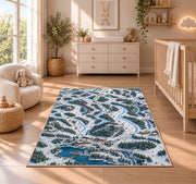Ski resort trail map rug in a nursery beside a crib and dresser